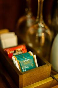 a wooden box filled with tea packets on a table at The Ledge Ella in Ella