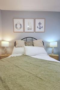a bedroom with a large bed with two lamps at 1BR Backyard Bliss - Apt 6 in Bridgewater