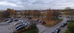 an aerial view of a parking lot with cars at Ruola in Kaunas