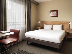 Postel nebo postele na pokoji v ubytování Aparthotel Adagio La Défense Esplanade