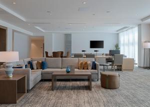 a living room with a couch and a table at Staybridge Suites Miramar Beach - Sandestin Area by IHG in Destin