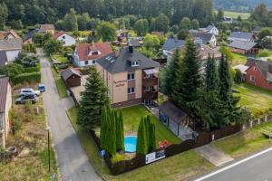 an aerial view of a house with a pool at Apartmany Agatha in Loučná nad Desnou