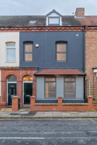 a blue house on the side of a street at Stockton Town centre en-suite rooms in Stockton-on-Tees