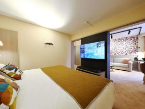 TV a/nebo společenská místnost v ubytování Mercure Grenoble Centre Porte des Alpes