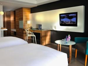 Ένα ή περισσότερα κρεβάτια σε δωμάτιο στο Pullman Mazagan Royal Golf & Spa