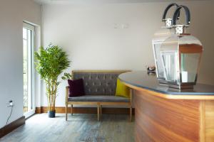 a dining room with a bench and a table at Clody Lodge in Bunclody