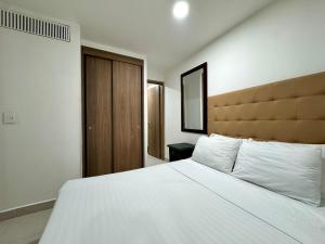 Ένα ή περισσότερα κρεβάτια σε δωμάτιο στο Velodromo