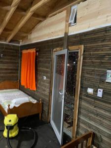 a room with a bed and a door to a balcony at Ohel in Mullini i Danit +27 photos