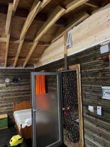 a room with a refrigerator in a room with a wall at Ohel in Mullini i Danit