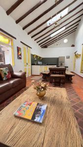 a living room with a couch and a table at Elephantia Spa Hotel in Villa de Leyva