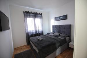 Ένα ή περισσότερα κρεβάτια σε δωμάτιο στο Stan na dan Luna