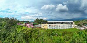 an aerial view of a building on a hill at Hotel Entre Lomas in Santa Rosa de Cabal