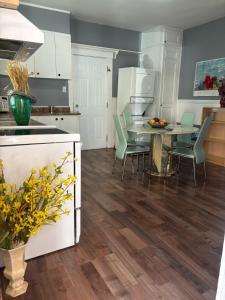 a kitchen and dining room with a table and chairs at Woodbridge Heritage Home in Vaughan