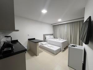 Giường trong phòng chung tại Marauí Guest House