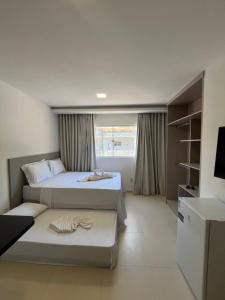 Ένα ή περισσότερα κρεβάτια σε δωμάτιο στο Marauí Guest House