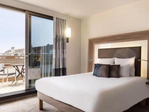 Ένα ή περισσότερα κρεβάτια σε δωμάτιο στο Novotel Genève Centre +92 φωτογραφίες