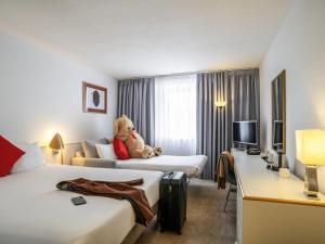 Ένα ή περισσότερα κρεβάτια σε δωμάτιο στο Novotel Glasgow Centre +115 φωτογραφίες