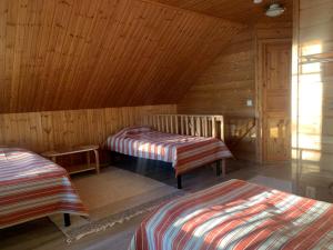 Postel nebo postele na pokoji v ubytování Tahkon Riihiranta - 4 bedroom villa by the lake - Tasokas tilava rantamökki