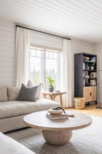a living room with a couch and a coffee table at Atlantic Pearl - Luxurious Ocean Front Experience 
