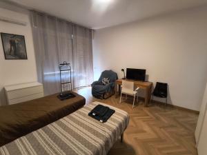 Postel nebo postele na pokoji v ubytování Bagaini Urban Flat