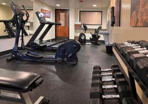 a gym with a treadmill and several exercise bikes at Red Feather Lodge/Hotel in Tusayan
