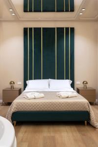 Ένα ή περισσότερα κρεβάτια σε δωμάτιο στο Isidoro Luxury Suites +26 φωτογραφίες