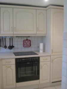 Kuchyň nebo kuchyňský kout v ubytování Kinkerbungalow + 12 fotografií