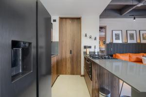 TV a/nebo společenská místnost v ubytování New Luxury Apartment