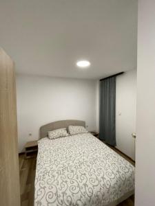 Ένα ή περισσότερα κρεβάτια σε δωμάτιο στο VilaJelena