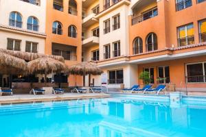 a swimming pool in front of a hotel at Rosa Boho Hotel And Aqua Park in Hurghada