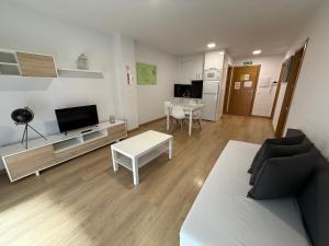 a living room with a couch and a table at SF40 Vut in Lugo