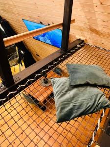 two pillows sitting on a hammock in a room at Lunascape in Sîntimbru-Băi