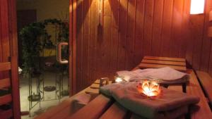 a room with a table with a candle on it at Ferienwohnung In Bayerisch Eisenstein Mit Garten in Bayerisch Eisenstein +19 photos