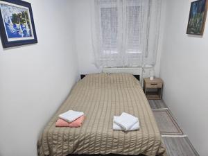 Ένα ή περισσότερα κρεβάτια σε δωμάτιο στο City Comfort Suite