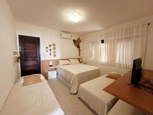 Postel nebo postele na pokoji v ubytování Casa Ilha| beira mar, piscina aquecida, 4 suítes