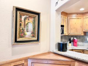 a kitchen with a painting on the wall at Swiss Zermatt 2BR Family Villa with Kitchen Near Park City & Deer Valley Ski Resorts - 8789 in Mound City