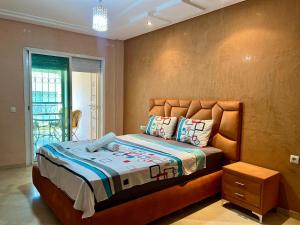 Ένα ή περισσότερα κρεβάτια σε δωμάτιο στο Prestigia Luxury Apartment - Fes Center