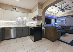 an open kitchen and living room with a couch at Salty Shores Secluded Oasis in Englewood