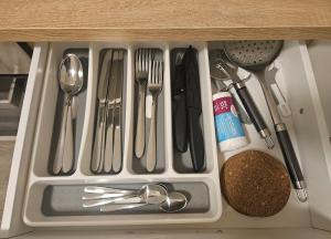 a drawer filled with utensils in a kitchen at Zentrale & gemütliche Wohnung in Wolfsburg in Wolfsburg