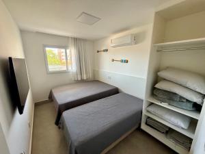 En eller flere senge i et værelse på Peracanga Bacutia Guarapari LS05 + 41 billeder