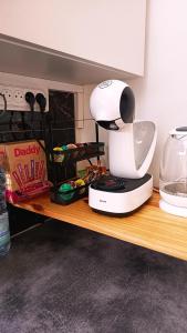 Kuchyň nebo kuchyňský kout v ubytování Appartement Belsol Ambiance tropicale et détente + 26 fotografií