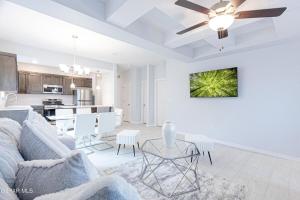 a living room and kitchen with a couch and a table at Confortable House in West Side in Canutillo