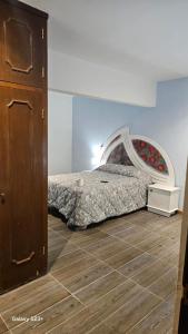 Ένα ή περισσότερα κρεβάτια σε δωμάτιο στο Casa Bigosh