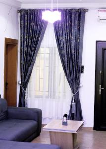 Posezení v ubytování EstateNg + 2 fotografie