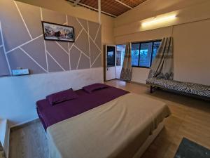 a bedroom with a large bed in a room at Sea view holiday resort in Borlai +64 photos
