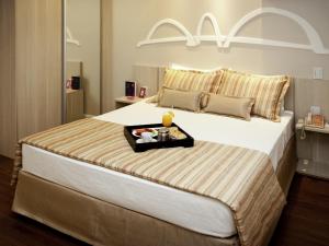 Postel nebo postele na pokoji v ubytování Mercure Brasilia Lider