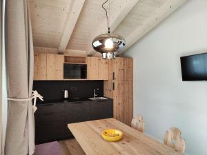 TV a/nebo společenská místnost v ubytování Camping Val di Sole