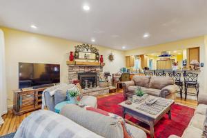 a living room with two couches and a fireplace at Colorado Pines Retreat in Lake Valley