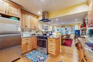a kitchen with wooden cabinets and a stove top oven at Colorado Pines Retreat in Lake Valley