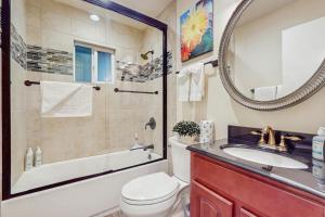 a bathroom with a toilet and a sink and a mirror at Colorado Pines Retreat in Lake Valley +6 photos